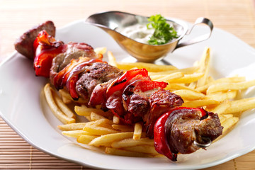 Grilled skewer with french fries