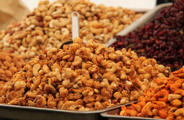 Trays of Prepared Nuts on a Food Retail Stall.