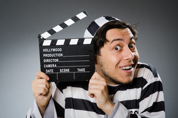 Inmate with movie clapper board