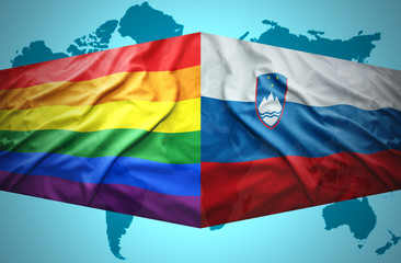 Waving Slovenian and Gay flags