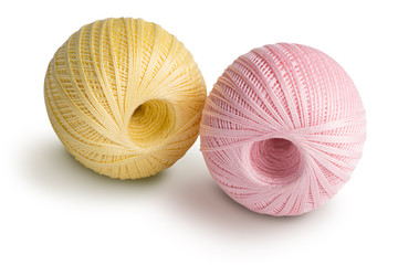 Pink and yellowl cotton yarn isolated on white