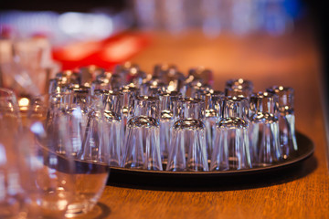 Beautiful line of different coloured cocktails on a open air par