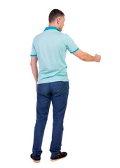 Back view of  man in checkered shirt shows thumbs up.