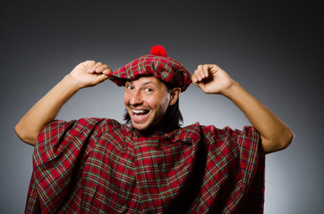 Funny scotsman in traditional clothing