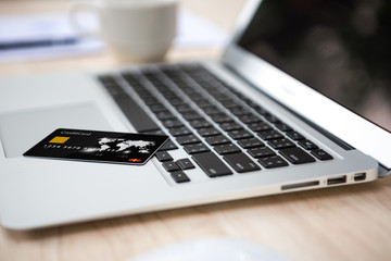 Close up of credit card on laptop  computer keyboard