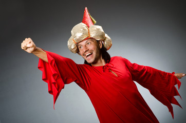 Funny wizard wearing red dress