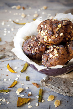 muffins with pumpkin chocolate and oat flakes on bowl