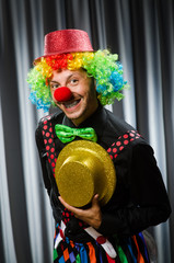  Funny clown in humorous concept against curtain
