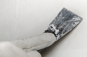 Applying parget with a spatula