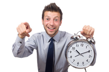 Man with clock trying to meet the deadline isolated on white