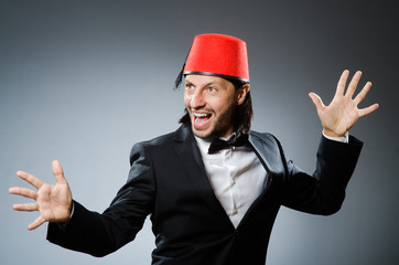 Man in traditional turkish hat and dress