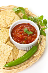 Spicy Red Salsa with tortilla chips. Selective focus.