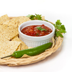Spicy Red Salsa with tortilla chips. Selective focus.