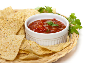 Spicy Red Salsa with tortilla chips. Selective focus.