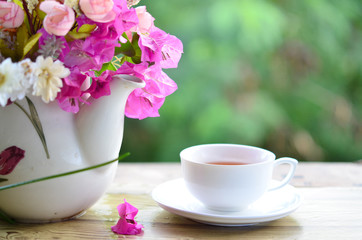 Obraz na płótnie Canvas flower in fresh morning with tea