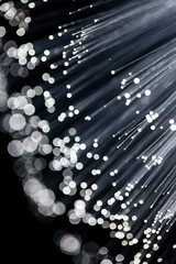 Fiber optics background with lots of light spots