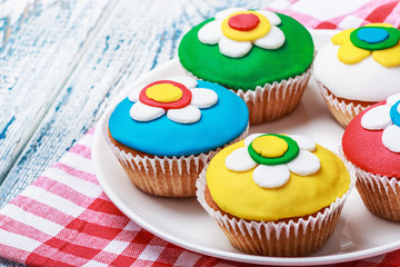 cupcakes decorated with colorful mastic