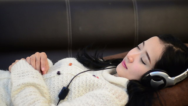 Asian woman teenager listing for relaxation with Headphone