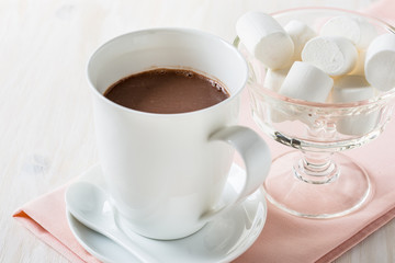 Cup of hot chocolate on a white table