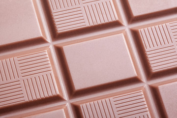 Closeup of milk chocolate bar as background
