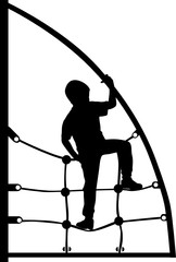 a boy climbing on the jungle gym rope