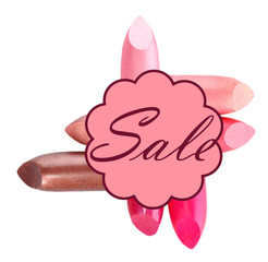 Sale concept. Several different lipsticks isolated on white