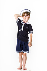 Cute little boy dressed in sailor suit