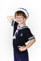 Cute little boy dressed in sailor suit