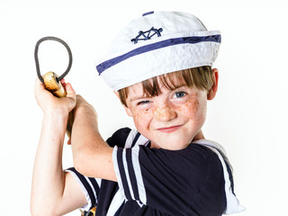 Cute little boy dressed in sailor suit