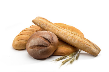assortment of baked bread in basket on white background
