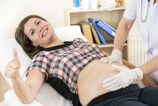 Pregnant woman being medical consulted