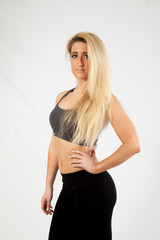 Fototapeta premium Blond woman in exercise outfit looking at the camera