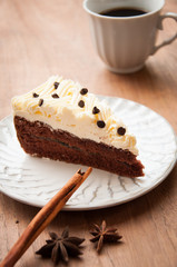 Slice piece of vanilla cake topping with white chocolate chips f