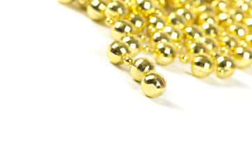Background made of a brilliant celebratory beads of golden color