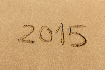 2015 happy new year - handwritten on sand