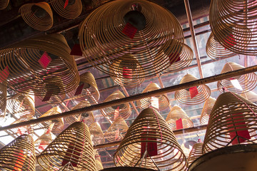 Incense Coils Burning In Temple