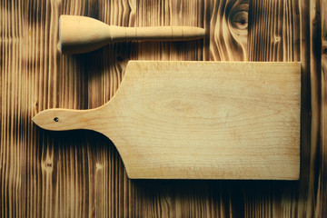 Empty vintage cutting board on planks food background concept