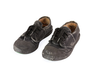 Old children sneakers on white background