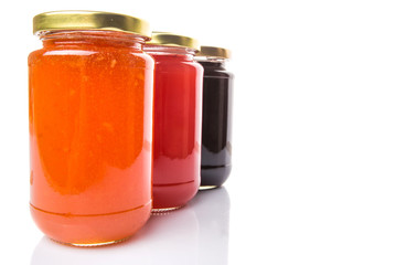 Blueberry, strawberry and orange fruit open lid bottled jam 