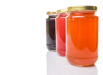 Blueberry, strawberry and orange fruit open lid bottled jam 