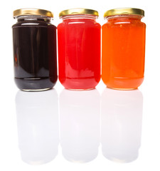 Blueberry, strawberry and orange fruit open lid bottled jam 