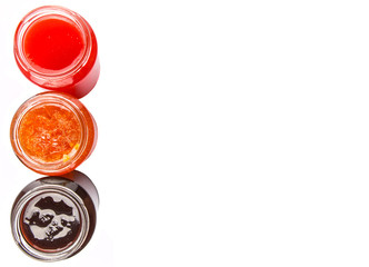 Blueberry, strawberry and orange fruit open lid bottled jam 