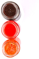 Blueberry, strawberry and orange fruit open lid bottled jam 