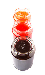 Blueberry, strawberry and orange fruit open lid bottled jam 