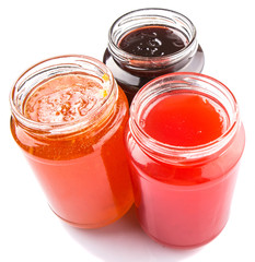 Blueberry, strawberry and orange fruit open lid bottled jam 