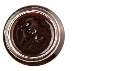 Bottled blueberry jam over white background