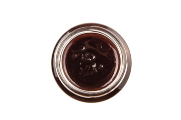 Bottled blueberry jam over white background