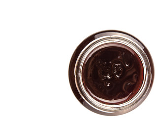 Bottled blueberry jam over white background