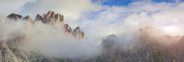 Tofane mountain range at foggy morning. Panorama from Falzarego