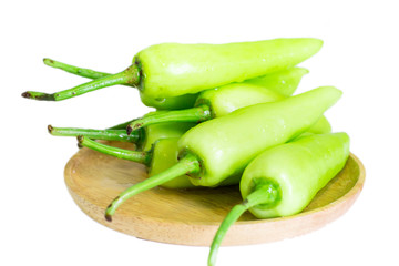 Green pepper chili on wooden dish